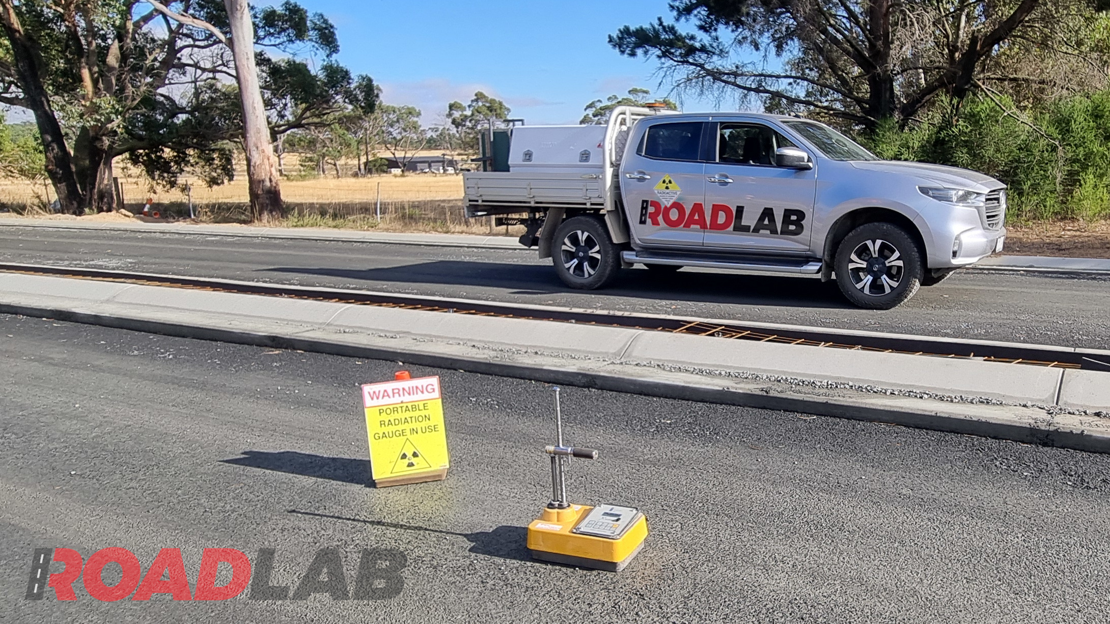 Testing the density of road pavement.